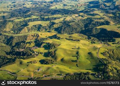 Aerial view of unique volcanic hills landscape in North Island of New Zealand. Panoramic shot from aircraft new Auckland.
