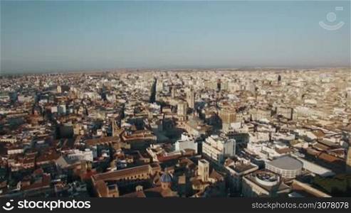 Aerial view of Valencia centre with ancient cathedral. Panorama of city from descending drone, Spain