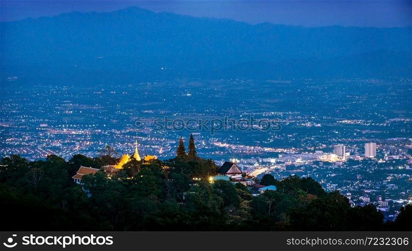 Aerial view of Wat Phra That Doi Suthep Temple in the evening, seen from top of Doi Suthep mountain in Chiang Mai, Thailand.. Aerial view of Wat Phra That Doi Suthep Temple in the evening.