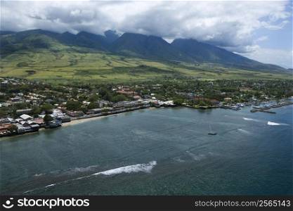 Aerial view of waterfront buildings on coastline of Maui, Hawaii.