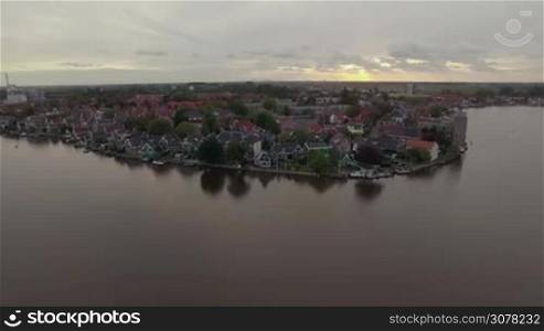 Aerial view of waterside township. Flying over the houses, Netherlands