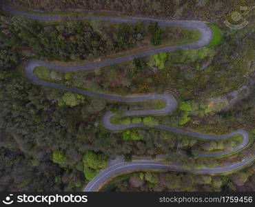 Aerial view of winding road in spring in Asturias, Spain.