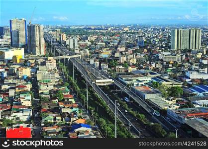 Aerial view on slum and highway in Metro Manila, Philippines
