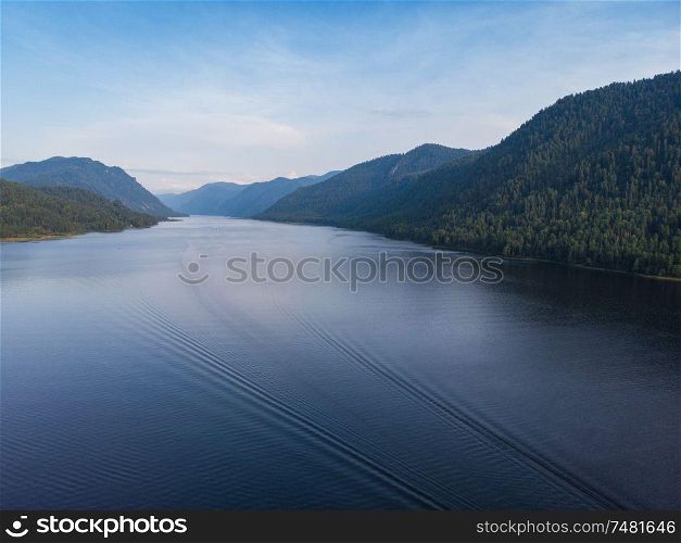 Aerial view on Teletskoye lake in Altai mountains, Siberia, Russia. Drone shot. Beauty summer day.. Aerial view on Teletskoye lake in Altai mountains