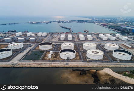 Aerial view or top view oil terminal is industrial facility for storage of oil and petrochemical. oil manufacturing products ready for transport and business transportation.