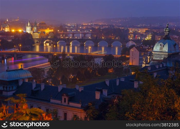 Aerial view over Old Town and bridges over the Vltava River in Prague at night, Czech Republic