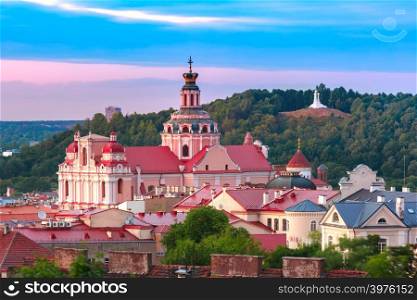 Aerial view over Old town with Church of St Casimir and Three Crosses on the Bleak Hill at sunset, Vilnius, Lithuania, Baltic states.. Old town at sunset, Vilnius, Lithuania