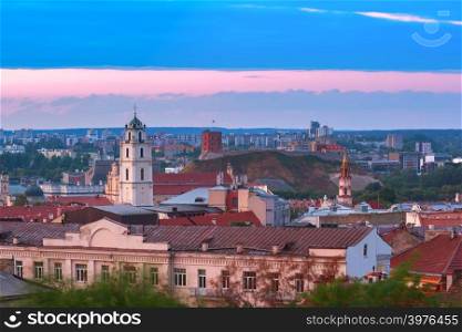 Aerial view over Old town with Gediminas Castle Tower and Church of St Johns at sunrise, Vilnius, Lithuania, Baltic states.. Old town at sunset, Vilnius, Lithuania