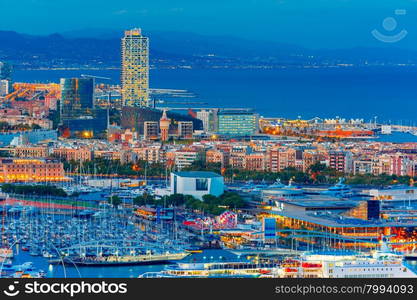 Aerial view over Port Vell marina, Barceloneta and Rambla de Mar at night in Barcelona, Catalonia, Spain