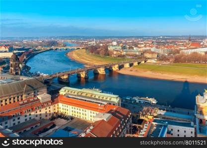 Aerial view over river Elbe with Augustus Bridge and roofs of old Dresden, Saxony, Germany