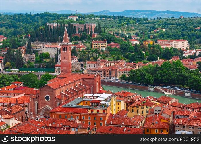 Aerial view over Santa Anastasia Church and red roofs in cloudy summer day, Verona, Italy