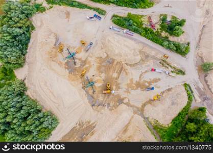 Aerial view over the building materials processing factory. Sand mine. View from above