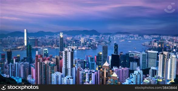 Aerial view panorama of Hong Kong skyline and Victoria Harbor at sunset. Travel destinations