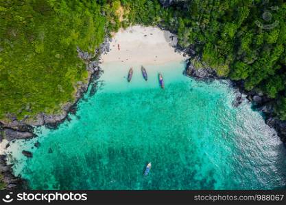 aerial view phi phi island beautiful landscape high season summer holiday tourists thai and foreign rent a long - tail boat and speed boat snorkel under the sea phi phi island kra bi Thailand