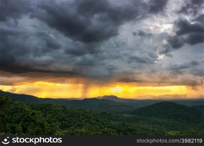 Aerial view rain storms and black clouds moving over the mountains In the north of Thailand, Pang Puey, Mae Moh, Lampang, Thailand.. Rain storms over the mountains. Pang Puey,