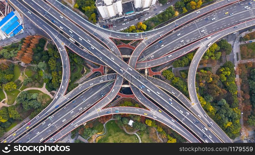 Aerial view Shanghai spectacular elevated highway and convergence of roads, bridges, junction and interchange overpass, viaducts in Shanghai, transportation and infrastructure development in urban China.