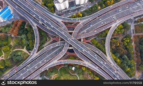 Aerial view Shanghai spectacular elevated highway and convergence of roads, bridges, junction and interchange overpass, viaducts in Shanghai, transportation and infrastructure development in urban China.