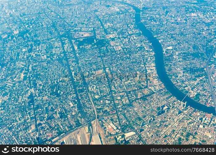 Aerial view to Bangkok downtown from a plane. Thailand asian city from above