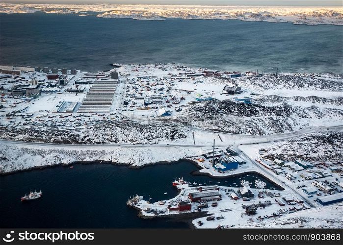 Aerial view to the fjord, port and snow streets of Greenlandic capital Nuuk city, Greenland