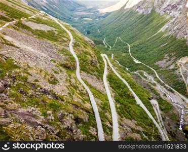 Aerial view. Trolls Path Trollstigen or Trollstigveien winding scenic mountain road in Norway Europe. National tourist route.. Trollstigen mountain road in Norway
