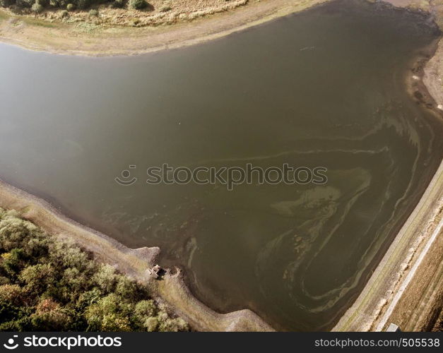 Aerial view with the drone of a large pond in the Upper Harz Mountains