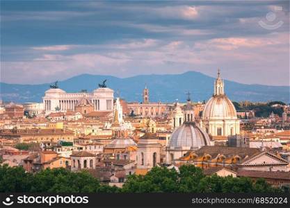 Aerial wonderful view of Rome at sunset, Italy. Panoramic aerial wonderful view of Rome with Altar of the Fatherland and churches at sunset time in Rome, Italy
