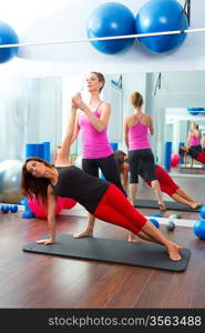 Aerobic Pilates personal trainer instructor in women gym fitness class