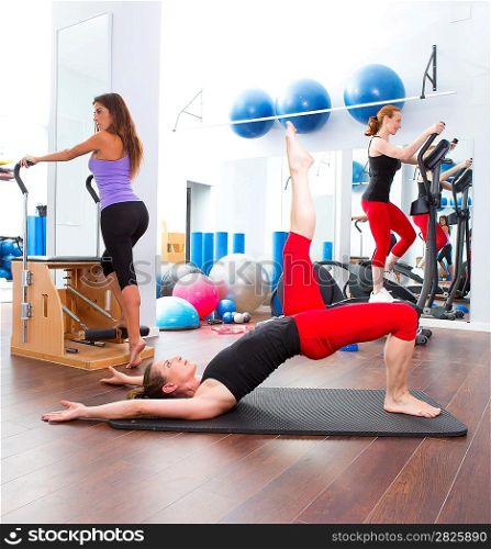 Aerobics pilates gym women group with crosstrainer