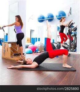 Aerobics pilates gym women group with crosstrainer