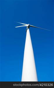 aerogenerator windmill in blue sky perspective background