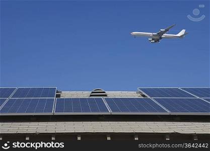 Aeroplane and rooftop with solar array Inglewood Los Angeles California