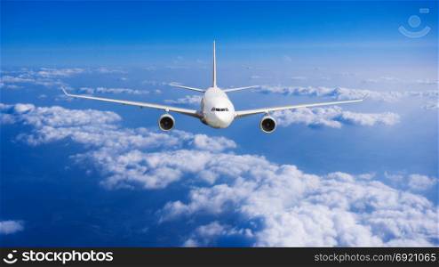 aeroplane flying above clouds. Passenger Airliner flying