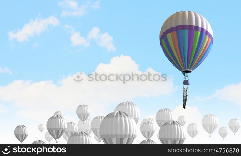 Aerostats in sky. Conceptual image with balloons flying high in sky