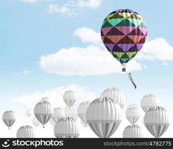 Aerostats in sky. Conceptual image with balloons flying high in sky
