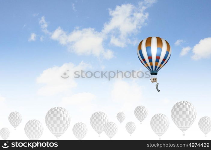 Aerostats in sky. Conceptual image with balloons flying high in sky