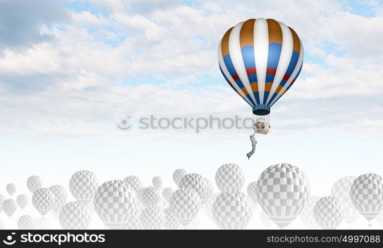 Aerostats in sky. Conceptual image with balloons flying high in sky