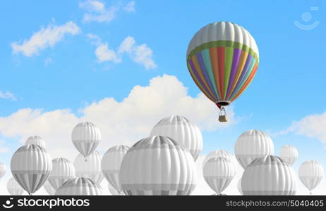 Aerostats in sky. Conceptual image with balloons flying high in sky