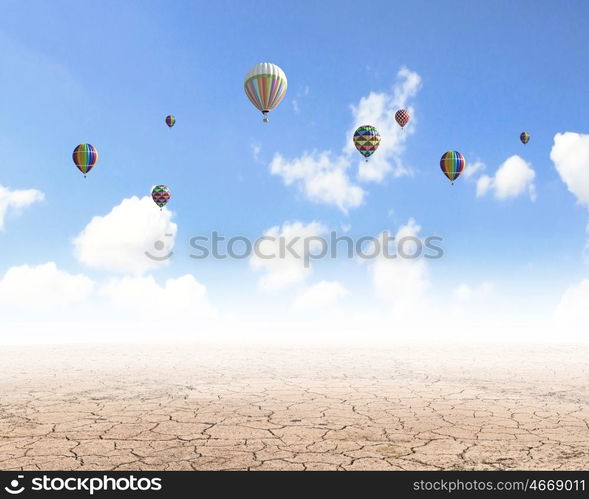 Aerostats in sky. Conceptual image with colorful balloons flying high in sky