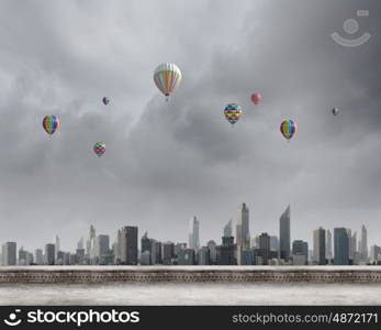 Aerostats in sky. Conceptual image with colorful balloons flying high in sky