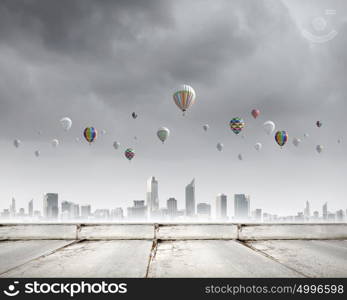 Aerostats in sky. Conceptual image with colorful balloons flying high in sky