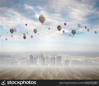 Aerostats in sky. Conceptual image with colorful balloons flying high in sky