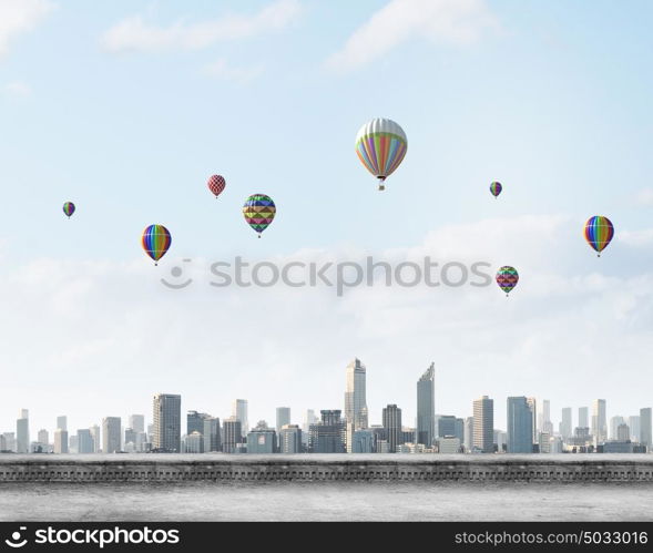 Aerostats in sky. Conceptual image with colorful balloons flying high in sky