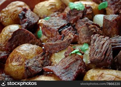 Afelia - a traditional Greek and Cypriot food. pork marinated and cooked in red wine