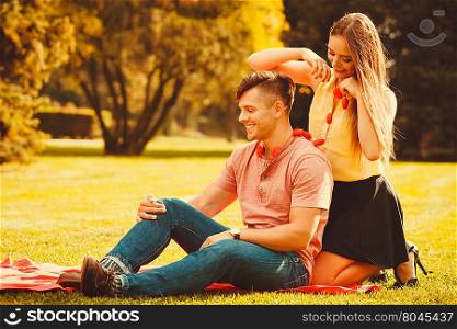 Affectionate couple cheering together. . Love romance relationship valentines dating concept. Affectionate couple cheering together. Young girl and boy hugging in park.