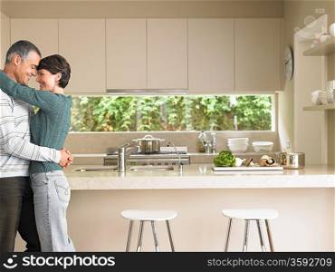 Affectionate Married Couple in Kitchen