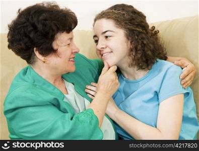 Affectionate mother together with her loving teenage daughter.