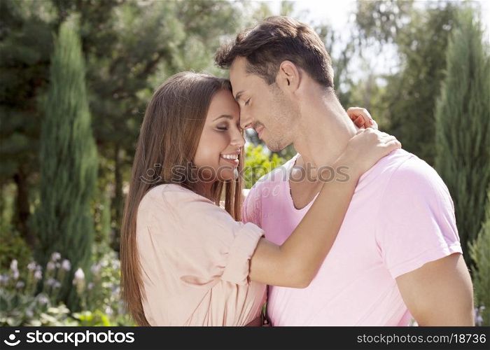 Affectionate young couple embracing in park
