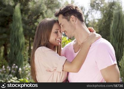 Affectionate young couple embracing in park