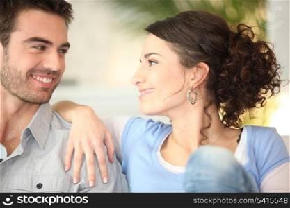 Affectionate young couple on couch