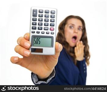 Afraid business woman showing calculator with sos inscription